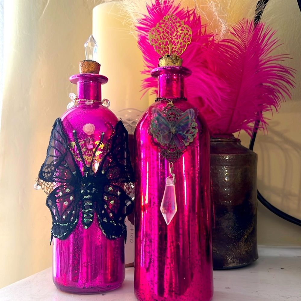 2 decorative fuchsia glass butterfly bottles